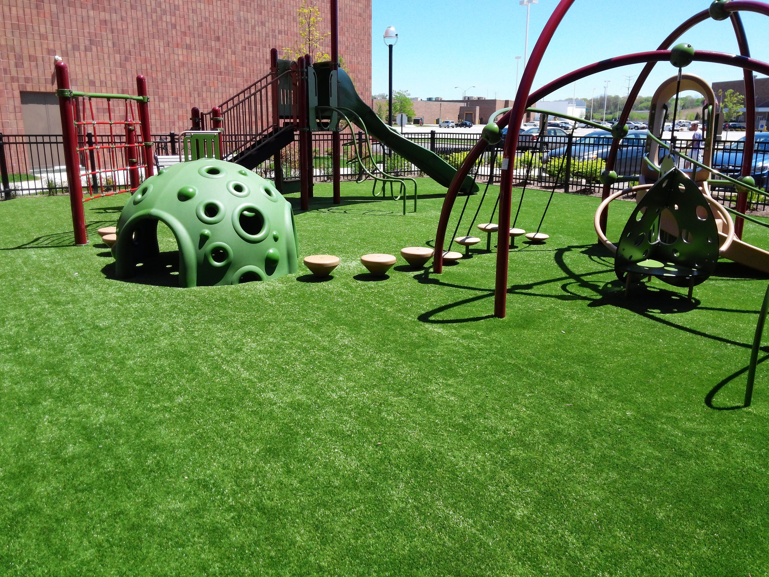 Artificial playground grass